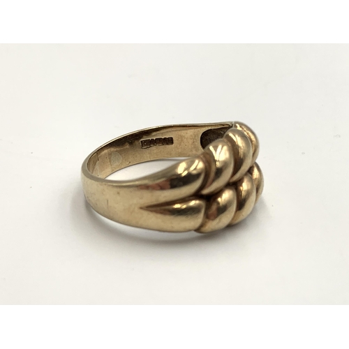 2152 - A hallmarked 9ct gold keeper ring, size U - approx. gross weight 5.2g