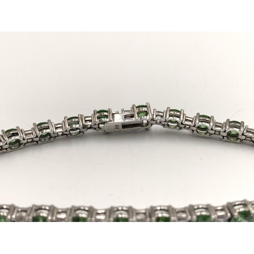 2153 - A .925 silver clear and green gemstone tennis bracelet - approx. gross weight 14g