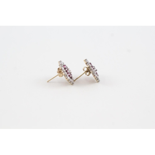 2008 - A pair of 9ct gold ruby and cubic zirconia cluster stud earrings with scroll backs - approx. gross w... 