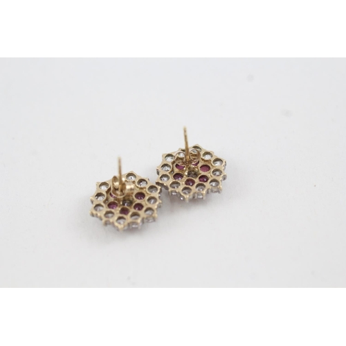 2008 - A pair of 9ct gold ruby and cubic zirconia cluster stud earrings with scroll backs - approx. gross w... 