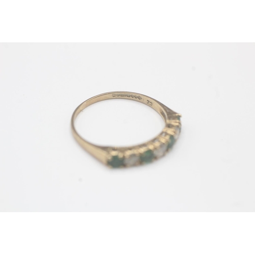 2019 - A 9ct gold emerald and cubic zirconia seven stone ring - approx. gross weight 1.2g