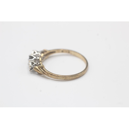 2021 - A 9ct gold diamond and sapphire three stone ring - approx. gross weight 1.4g