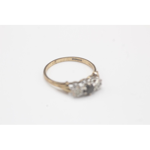 2021 - A 9ct gold diamond and sapphire three stone ring - approx. gross weight 1.4g