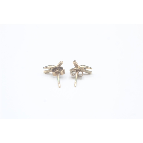 2033 - A pair of 9ct gold diamond stud earrings - approx. gross weight 0.6g