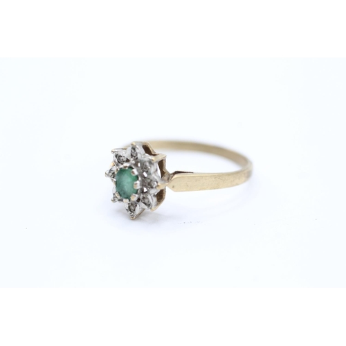 2059 - A 9ct gold emerald single stone ring with diamond surround - approx. gross weight 1.6g