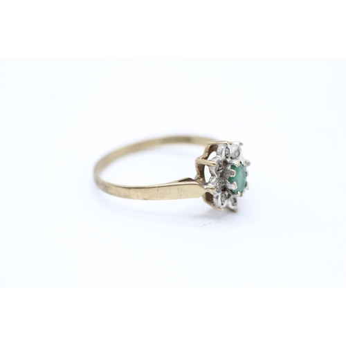 2059 - A 9ct gold emerald single stone ring with diamond surround - approx. gross weight 1.6g