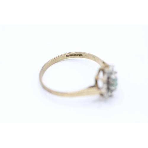 2059 - A 9ct gold emerald single stone ring with diamond surround - approx. gross weight 1.6g