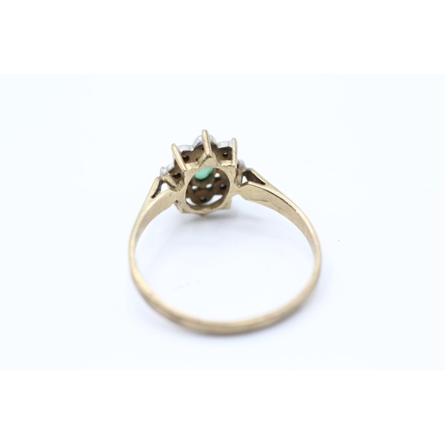 2059 - A 9ct gold emerald single stone ring with diamond surround - approx. gross weight 1.6g