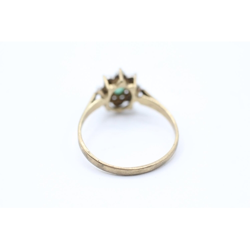 2059 - A 9ct gold emerald single stone ring with diamond surround - approx. gross weight 1.6g