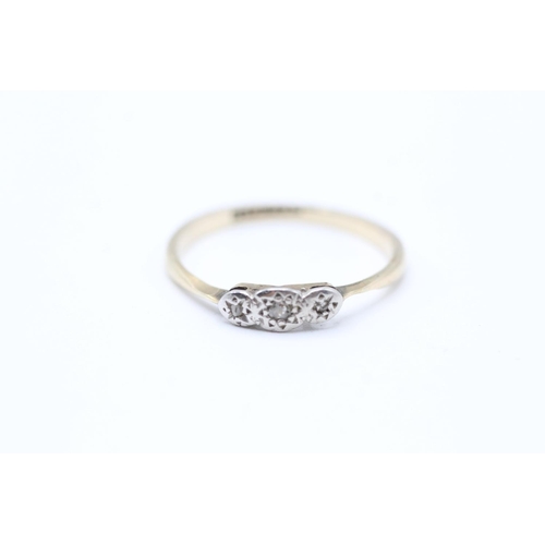 2063 - A 9ct gold and platinum diamond three stone ring - approx. gross weight 1.8g