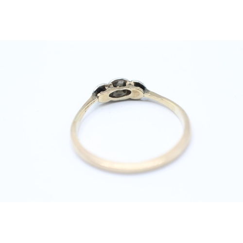 2063 - A 9ct gold and platinum diamond three stone ring - approx. gross weight 1.8g