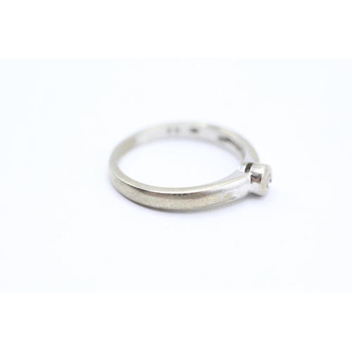 2066 - A 9ct white gold bezel set diamond single stone ring - approx. gross weight 2.4g