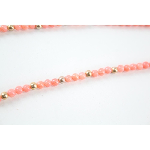 2079 - A coral single strand necklace with 9ct gold spacers and clasp - approx. gross weight 14.6g