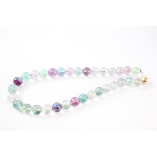 2080 - A vari-hue fluorite single strand necklace with 18ct gold clasp - approx. gross weight 98.4g