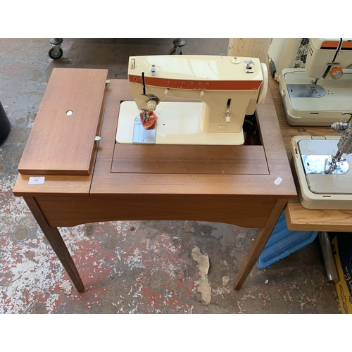 784 - A sewing machine table containing Singer 367 electric sewing machine