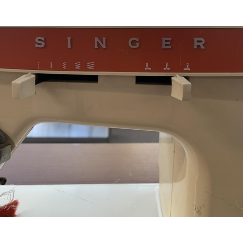 784 - A sewing machine table containing Singer 367 electric sewing machine