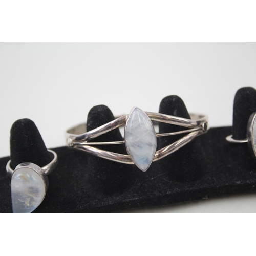 2094 - Three pieces of .925 silver moonstone set jewellery, two rings and one cuff bracelet - approx. gross... 