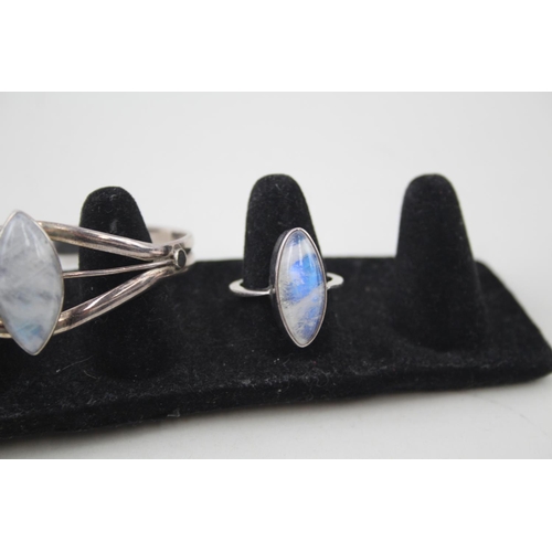 2094 - Three pieces of .925 silver moonstone set jewellery, two rings and one cuff bracelet - approx. gross... 