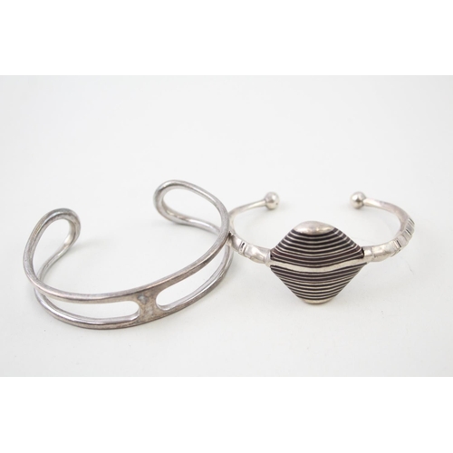 2098 - Two Modernist sterling silver bangles - approx. gross weight 68g