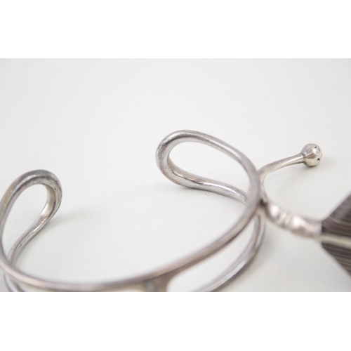 2098 - Two Modernist sterling silver bangles - approx. gross weight 68g