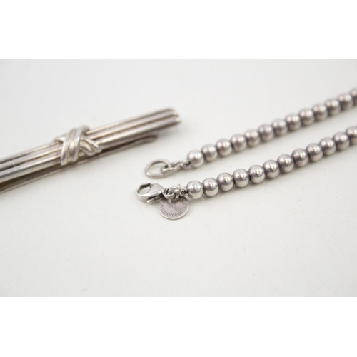 2100 - Two pieces of Tiffany & Co .925 silver jewellery, one bracelet and one tie clip - approx. gross weig... 