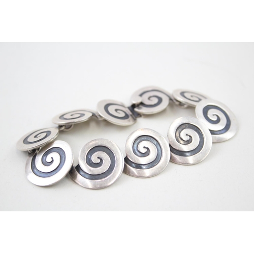 2102 - A Mexican Maricela Tasco sterling silver swirl panel bracelet - approx. gross weight 37g