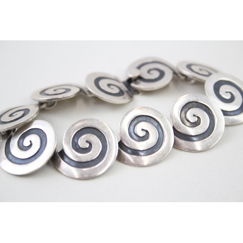 2102 - A Mexican Maricela Tasco sterling silver swirl panel bracelet - approx. gross weight 37g