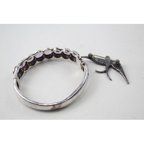 2109 - Two pieces of hallmarked sterling silver and marcasite jewellery, one amethyst set bangle and one sw... 