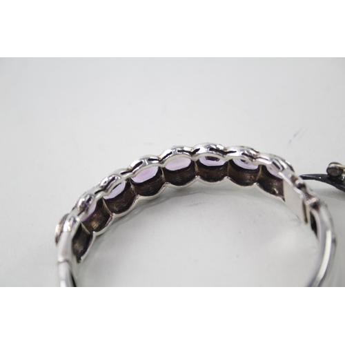 2109 - Two pieces of hallmarked sterling silver and marcasite jewellery, one amethyst set bangle and one sw... 