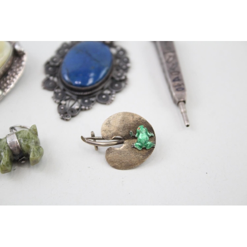 2110 - Five pieces of sterling silver jewellery to include Egyptian Revival pendant pencil, filigree blue g... 