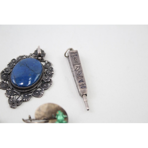 2110 - Five pieces of sterling silver jewellery to include Egyptian Revival pendant pencil, filigree blue g... 