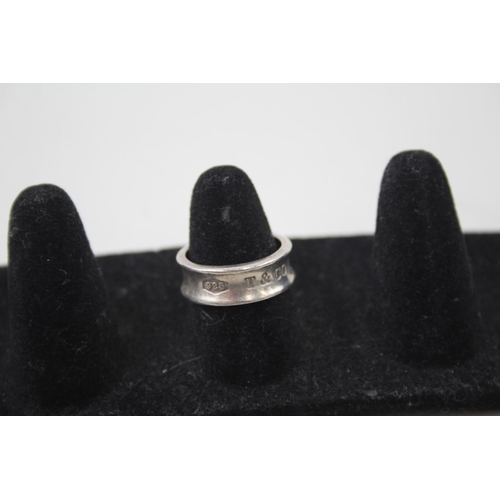 2113 - A Tiffany & Co .925 silver concave band ring, size M - approx. gross weight 5g