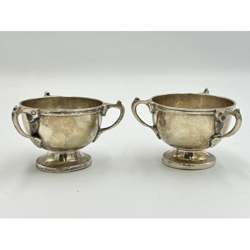 2213 - A pair of Williams (Birmingham) Ltd hallmarked Birmingham silver three handled condiment dishes, dat... 