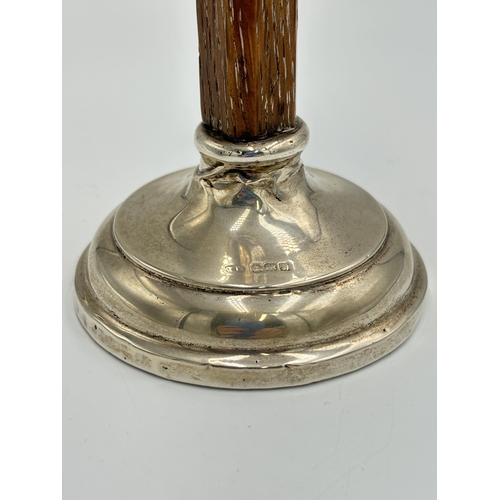 2215 - A hallmarked Birmingham silver and oak candlestick, dated 1910 - approx. 14cm high