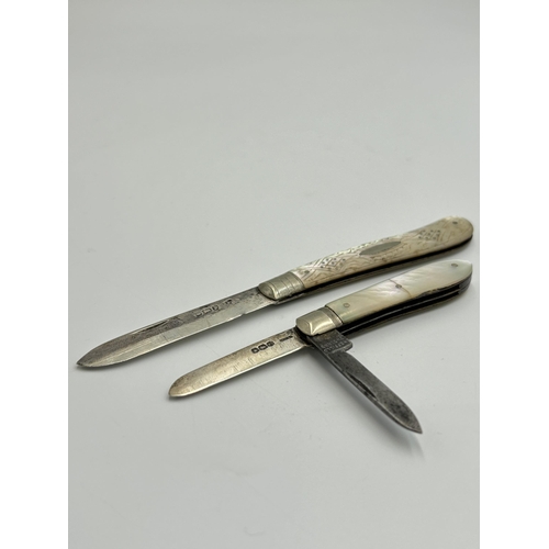 2216 - Two hallmarked Sheffield silver and mother of pearl pocket knives, one dated 1920 and one dated 1907