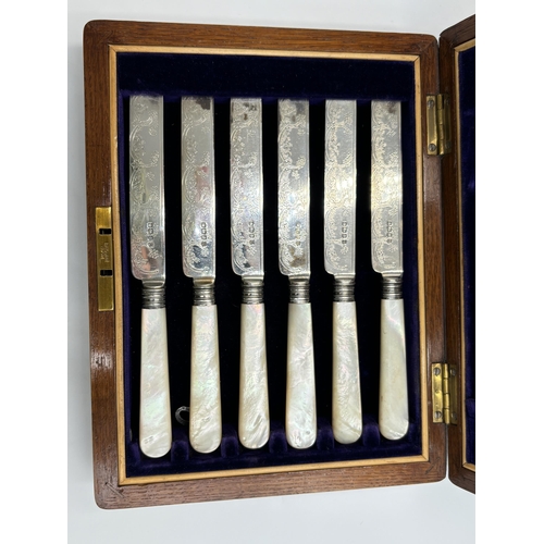 2218 - An oak cased hallmarked Sheffield silver and mother of pearl handled 12 piece cutlery set, dated 190... 