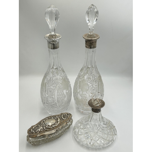 2219 - Four hallmarked sterling silver and cut glass items, two decanters, dated 1978 - approx. 37cm high, ... 