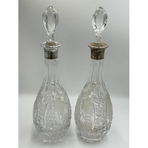 2219 - Four hallmarked sterling silver and cut glass items, two decanters, dated 1978 - approx. 37cm high, ... 