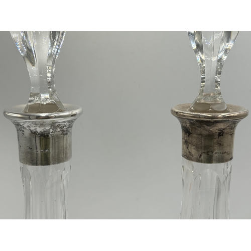 2219 - Four hallmarked sterling silver and cut glass items, two decanters, dated 1978 - approx. 37cm high, ... 