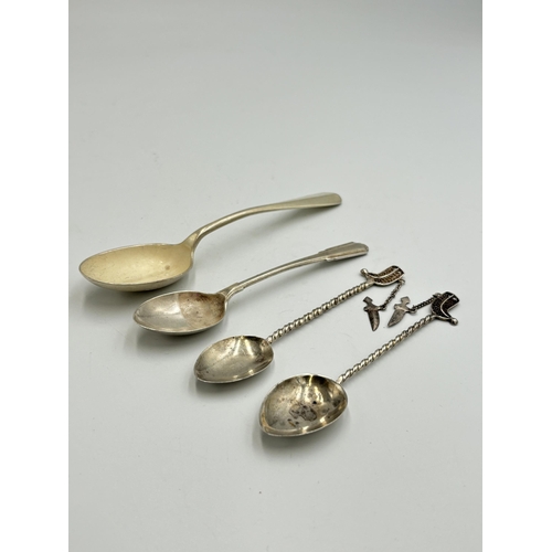 2224 - Nine hallmarked sterling silver and white metal items, two Dubai white metal souvenir spoons, three ... 