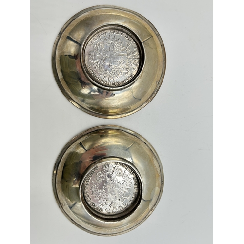 2225 - A pair of white metal circular footed dishes each set with Maria Theresa .833 silver Thaler coins - ... 