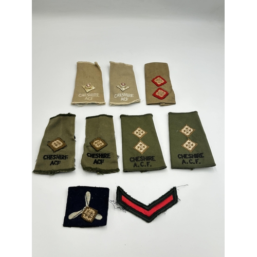 2295 - Ten military cloth patches and epaulettes to include Cheshire A.C.F. etc.