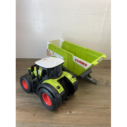 420 - A collection of toy vehicles to include Dickie Claas tractor and trailer, Toy State Industrial Ltd. ... 