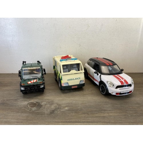 420 - A collection of toy vehicles to include Dickie Claas tractor and trailer, Toy State Industrial Ltd. ... 