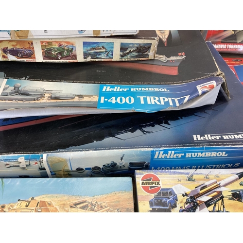 445 - A collection of model kits to include Airfix, Frog, Revell, Heller etc.