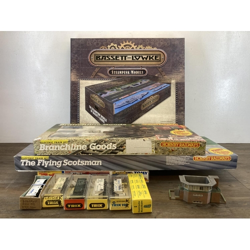 446 - A collection of model railway accessories to include four cased Trix model railway tenders, boxed To... 