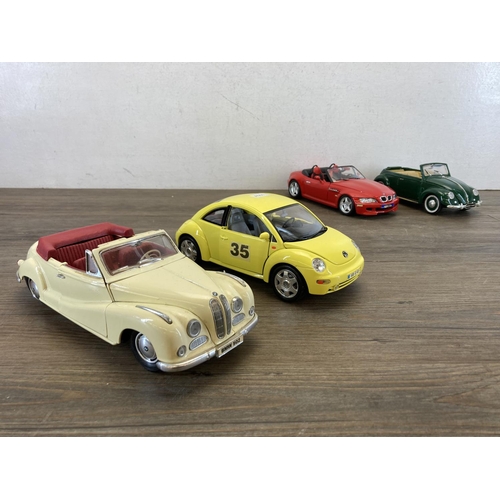 453 - Six diecast model vehicles, Maisto 1951 Volkswagen Beetle, Maisto BMW 502, Bburago Volkswagen New Be... 