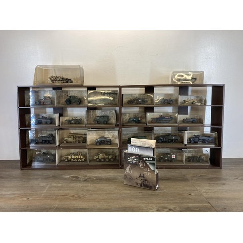 454 - Two four tier wall hanging display cases containing a collection of cased Atlas Editions WWII milita... 