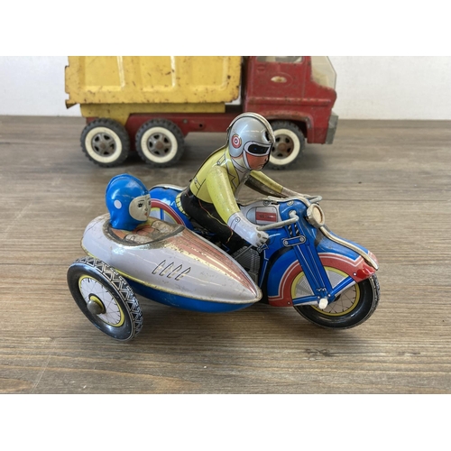 460 - Two mid 20th century tinplate toys, one clockwork tricycle and one Tonka tipper truck