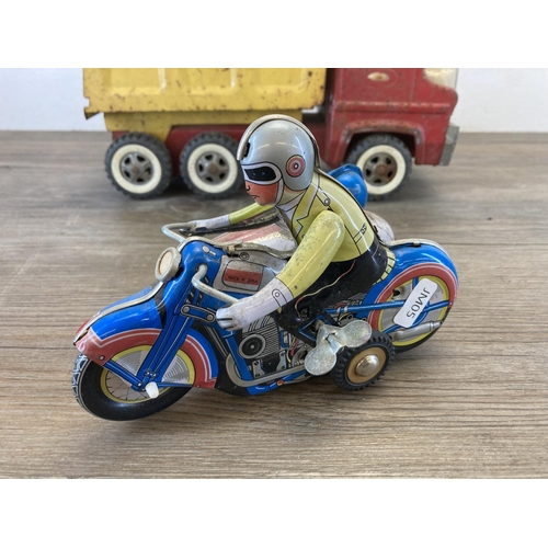 460 - Two mid 20th century tinplate toys, one clockwork tricycle and one Tonka tipper truck